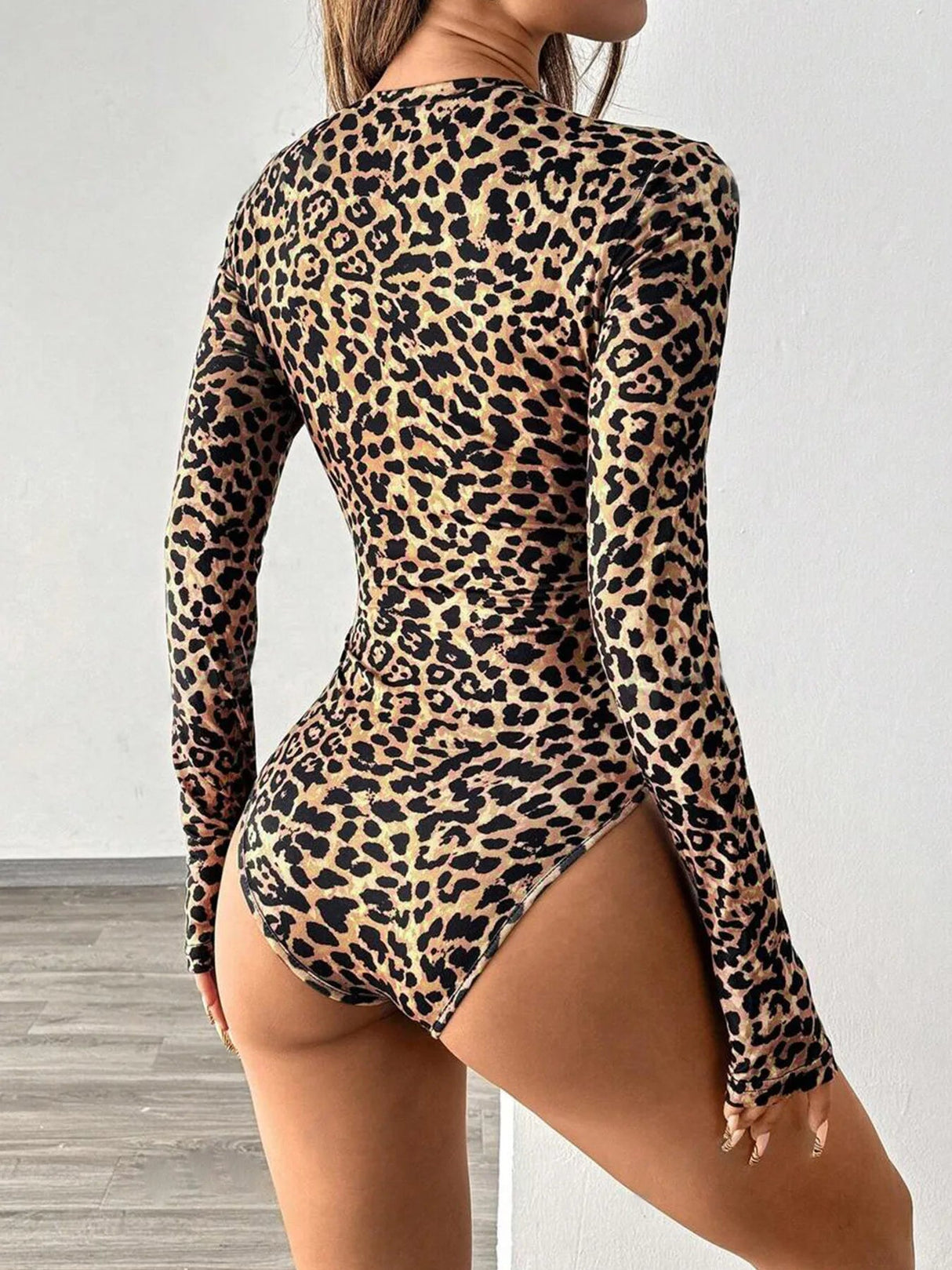 back view of leopard print long sleeve shapewear bodysuit with thong cut