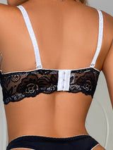 Back view of lace bra with white straps from black and white lingerie set