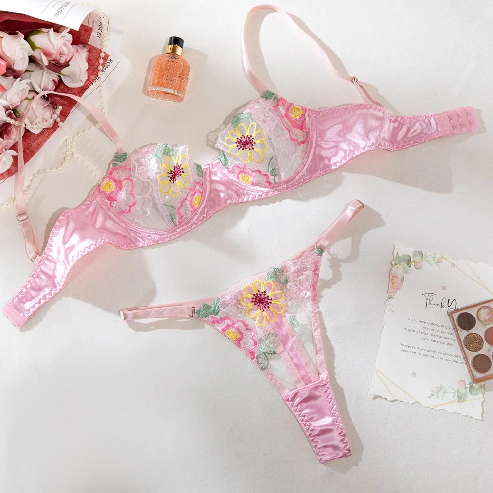 Flatlay of the Fuchsia Pink Rhinestone Bralette Lingerie Set with floral embroidery and sheer mesh
