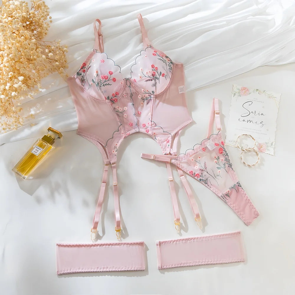 Flat lay of Light Pink Ribbed Bralette & Briefs Set with floral embroidery and garter straps