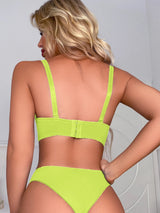 Back view of lime green lingerie set showing adjustable straps and hook closure